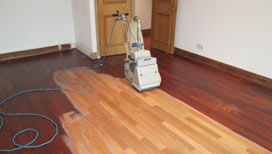 Sanding or replacing the old wood floors?